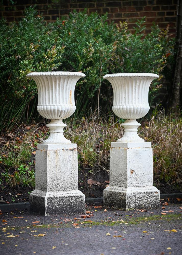 A LARGE PAIR OF WHITE PAINTED IRON CAMPANA VASES AND BASES, 19TH CENTURY