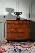 A QUEEN ANNE WALNUT AND INLAID CHEST OF DRAWERS, CIRCA 1710