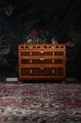 A WILLIAM & MARY OLIVEWOOD OYSTER VENEERED AND HOLLY CROSSBANDED CHEST OF DRAWERS, CIRCA 1690