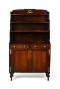 Y A REGENCY ROSEWOOD AND GILT METAL MOUNTED WATERFALL BOOKCASE, CIRCA 1815