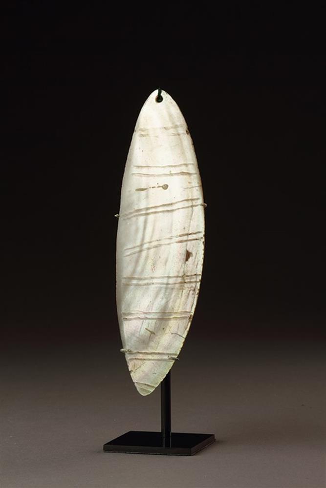 A CENTRAL DESERT ABORIGINAL RAIN MAKER'S PEARL SHELL ORNAMENT 'RINGILI'
