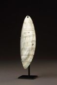 A CENTRAL DESERT ABORIGINAL RAIN MAKER'S PEARL SHELL ORNAMENT 'RINGILI'