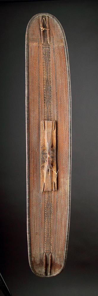 A CENTRAL AFRICAN MONGO SAKA PEOPLES LONG OVAL WICKERWORKED SHIELD, DEMOCRATIC REPUBLIC OF CONGO - Image 3 of 7
