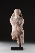 A RARE ANCIENT BRITISH CELTIC CARVED RED SANDSTONE STATUETTE, 1ST-2ND CENTURY AD