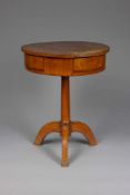 A CIRCULAR CHERRY WOOD DRUM SIDE TABLE