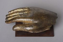 A HEAVY CAST GILDED BRONZE RIGHT HAND OF THE BUDDHA SHAKYAMUNI, 15TH CENTURY