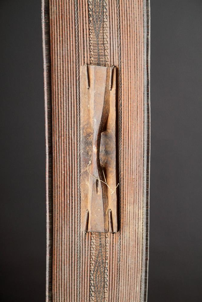 A CENTRAL AFRICAN MONGO SAKA PEOPLES LONG OVAL WICKERWORKED SHIELD, DEMOCRATIC REPUBLIC OF CONGO - Image 4 of 7