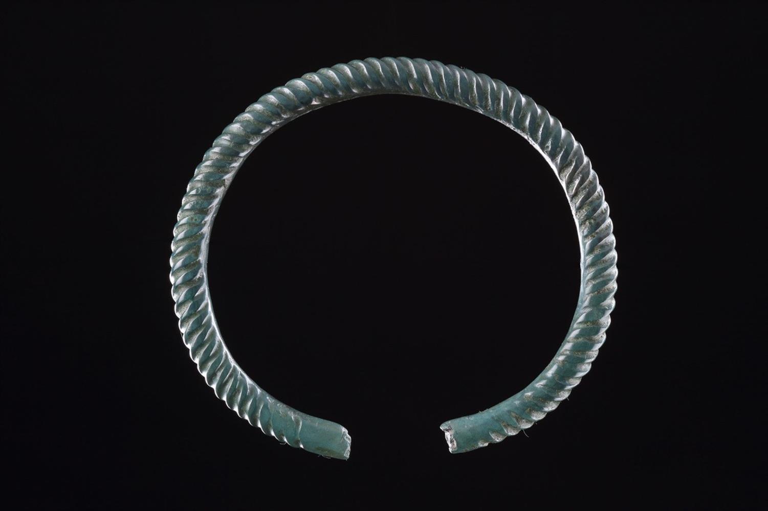 A FINE CELTIC CAST COPPER ALLOY ARM RING