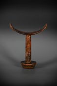 A FINE CARVED WOOD 'BONI' NECK-REST, SOMALIA