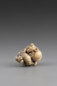 A JAPANESE CARVED STAG'S HORN NETSUKE, 18TH CENTURY/EARLY 19TH CENTURY