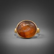 A CORNELIAN INTAGLIO RING, POSSIBLY 3-5TH CENTURY
