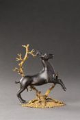 A SMALL SOUTH GERMAN GILT BRONZE GROUP OF A PRANCING STAG, NUREMBERG OR AUGSBURG