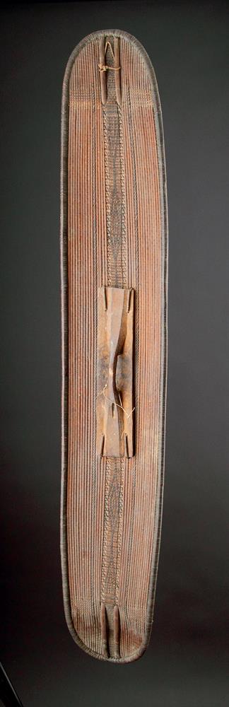A CENTRAL AFRICAN MONGO SAKA PEOPLES LONG OVAL WICKERWORKED SHIELD, DEMOCRATIC REPUBLIC OF CONGO - Image 2 of 7