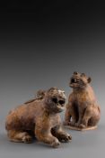 TWO BROWN GLAZED POTTERY FIGURES OF A TIGER AND CUB