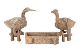A PAIR OF CHINESE POTTERY MODELS OF GEESE, HAN DYNASTY