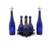 A SET OF THREE BRISTOL BLUE GLASS DECANTERS, 19TH CENTURY