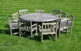 A WEATHERED TEAK GARDEN SUITE, BY BRITANNIC TEAK