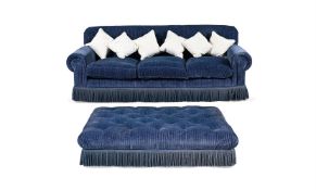 A BLUE CORDED VELVET UPHOLSTERED THREE-SEAT SOFA AND OTTOMAN
