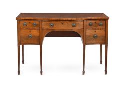 A GEORGE III MAHOGANY SERPENTINE FRONTED SIDEBOARD, CIRCA 1790