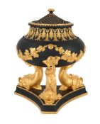 A LIMITED EDITION WEDGWOOD BLACK BASALT AND PARCEL GILT PASTILLE BURNER AND PIERCED COVER