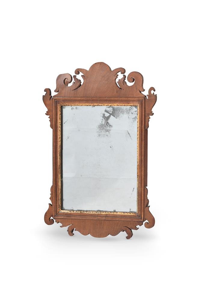 A GEORGE II MAHOGANY AND PARCEL GILT FRET MIRROR, CIRCA 1750