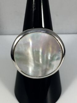 DISC SHAPE STERLING SILVER RING WITH MOTHER OF PEAR.