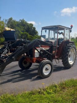 INTERNATIONAL 574 TRACTOR WITH LOADER - RELIABLE AND READY