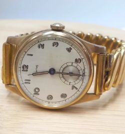 SMITHS EARLY 9CT GOLD HALLMARKED 375 MECHANICAL 1947/8 (RARE). EXPANDABLE STRAP