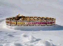 9CT RAINBOW DIAMOND BRACELET 7 1/2 LENGTH.
