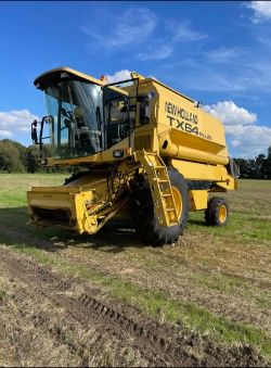 1999 NEW HOLLAND TX64 PLUS COMBINE WITH 20FT HEADER