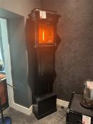 Upcycled Grandfather clock lamp with orange LED bulb, by artist Tanya Tier