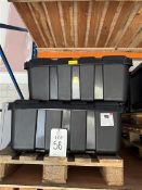 Four large plastic storage boxes