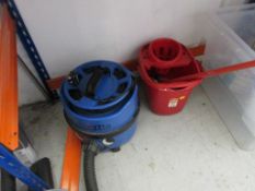 Contents of cleaning cupboard including Numatic vacuum, mops, buckets, gloves, overalls, brushes,