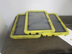 Three Amazon tablets, with rubber protection cases