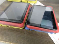 Four Amazon tablets, with rubber protection cases