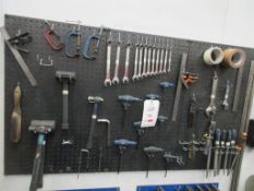 Wall mounted shadow boards with assorted hand tools including spanners, files, G clamps etc.