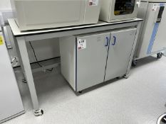 1 x mobile table and 1 x double door cupboard to include contents of cupboard