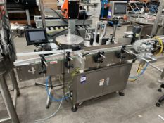 Label applicator with single spool. Through jar labeller (date coder separate). Through conveyor 200