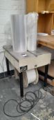 Gordian Semi-automatic strapping machine. Model: D53, No: 534306003, 240 volt (EXCLUDING Shrink wrap