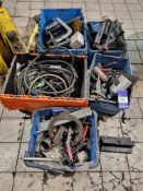 5x plastic containers containing pullers and other workshop consumables
