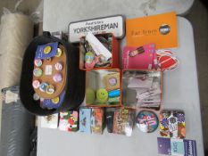 Assorted keyrings, coasters and buttons