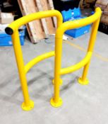 Pair of yellow car park barriers