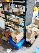Large quantity of One-Lux emergency lighting batteries to floor and shelving
