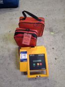 Three various training defibrillators