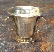 Golfing interest - a silver miniature trophy in the form of a tyg, engraved Troon, Oct. 1949
