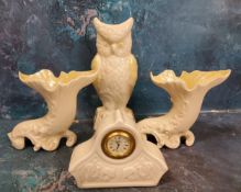 A Belleek Owl vase, lustrous yellow wings, 21.5cm high, green mark;  a pair of similar cornucopia