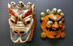 An Indian  wooden wall mask of Mahakal Bhairab, 32cm high;  another, dance mask (2)