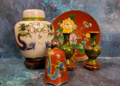A Japanese cloisonne ginger jar and cover, enamelled with dragons chasing the flaming pearl,