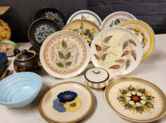A Denby stoneware plate, painted by Glyn Colledge, with stylised leaves, 25.5cm diam, printed