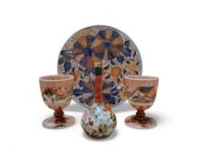 A Japanese Imari circular plate, decorated with floral roundels and foliage, 21.5cm diam, Meiji